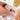 Baby in rosa Babybadewanne mit Naturkosmetik med Pflegebad von das boep und annisbuntewelt für sehr empfindliche Haut und Neurodermitis in der Hand