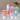 Die Babyprodukte von das boep stehen nebeneinander und eine Blumenvase steht im Hintergrund